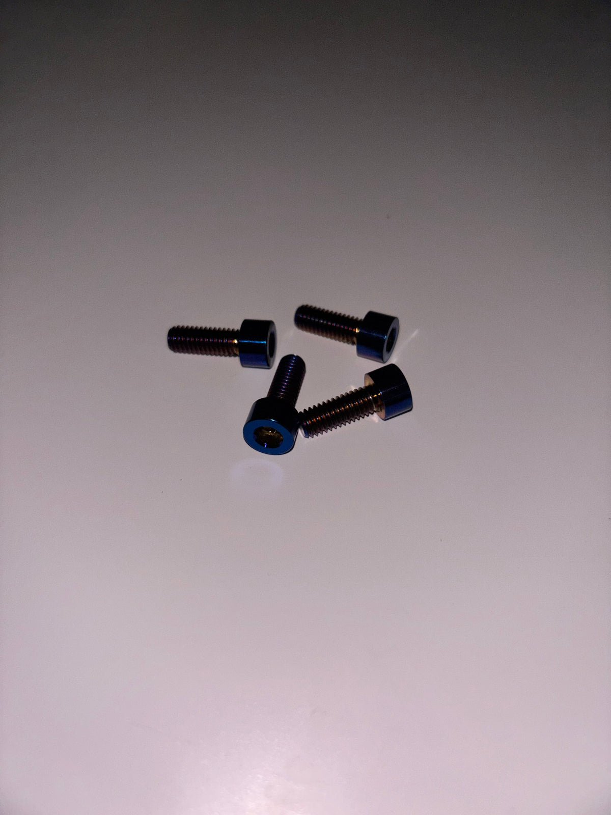 Surron Ultra Bee Titanium Side-Panel Bolts – 4-Piece Set