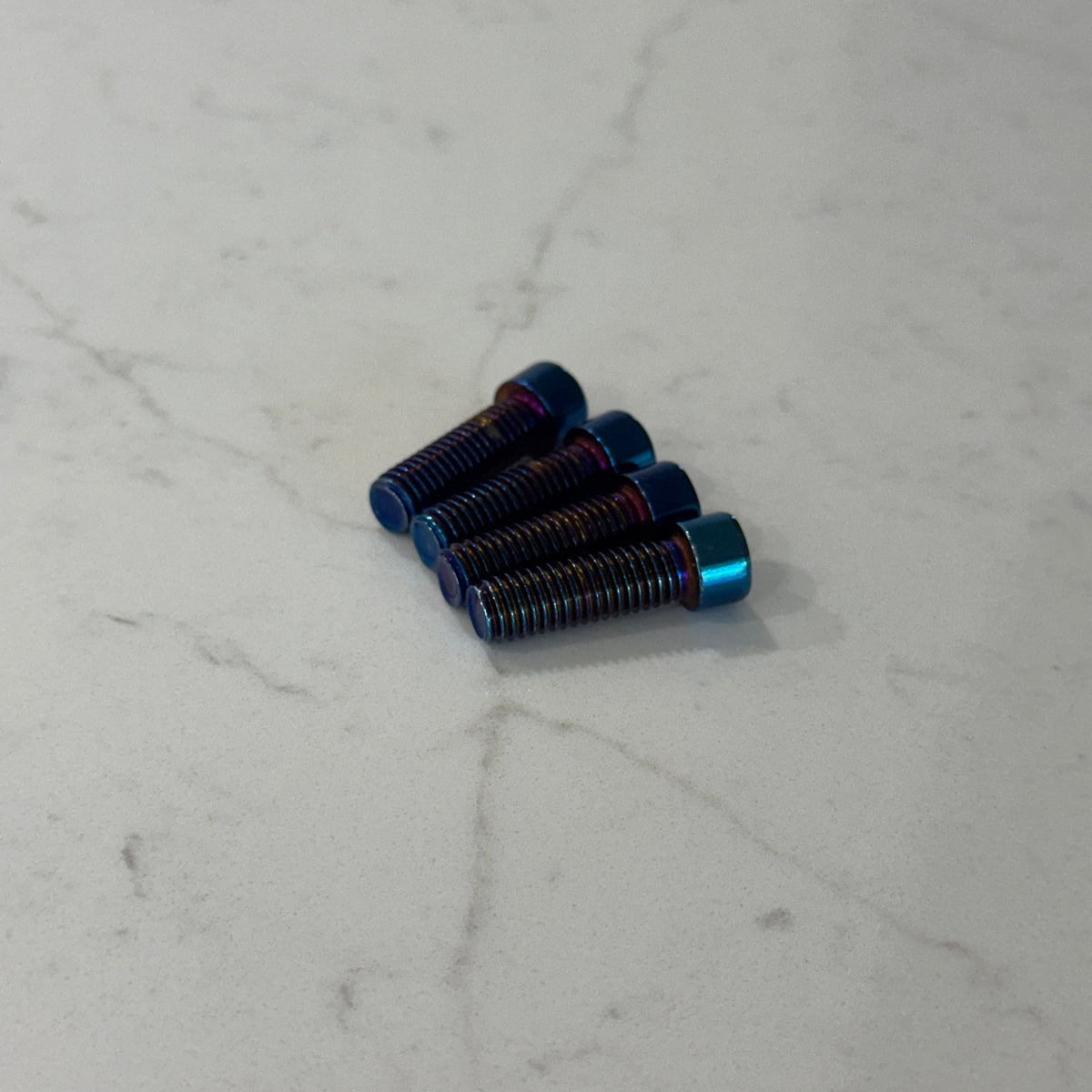Burnt Blue Titanium Peg Mount Bolts for Surron & E-Moto | Set of 4