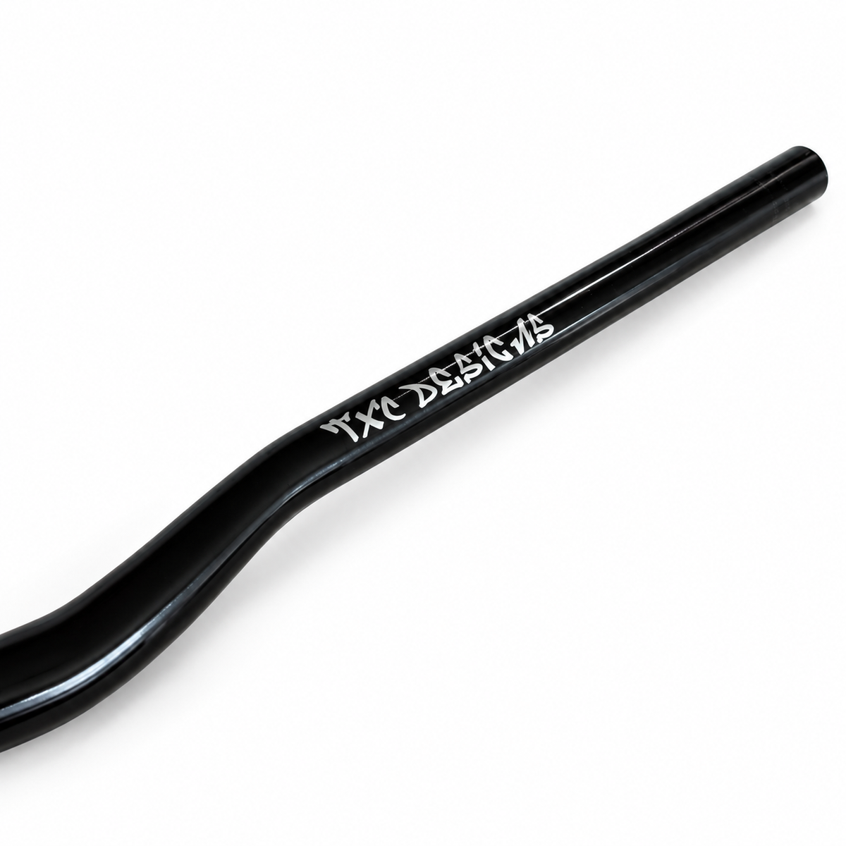 Glossy black TXC Vanta Series 31.8 mm direct-mount e-moto handlebar, close-up of the TXC Designs branding.
